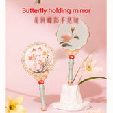 Butterfly holding mirror